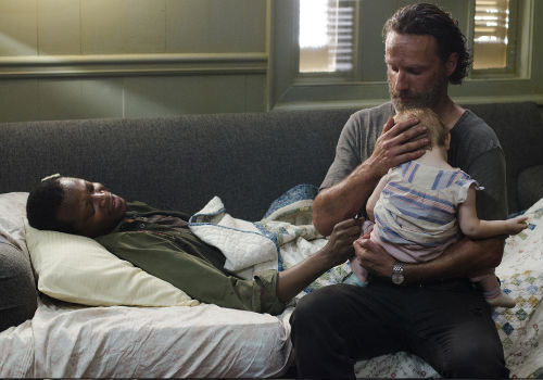 In a powerfully emotional, though understated scene Bob imparts his final sermon of positivity, one not grounded in Hallmark-birthed warm and fuzzies but gleaned from life in the apocalypse where you always choose who you are and who you will remain (image (c) Photo by Gene Page/AMC via official AMC TWD page)