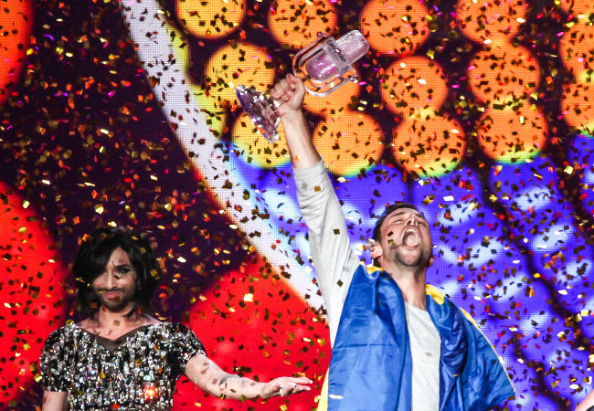 Måns Zelmerlöw stans triumphant after he wins this year's Eurovision Song Contest after an early neck-and-neck tussle in the voting with Russia (image Elena Volotova (EBU) via Eurovision.tv)