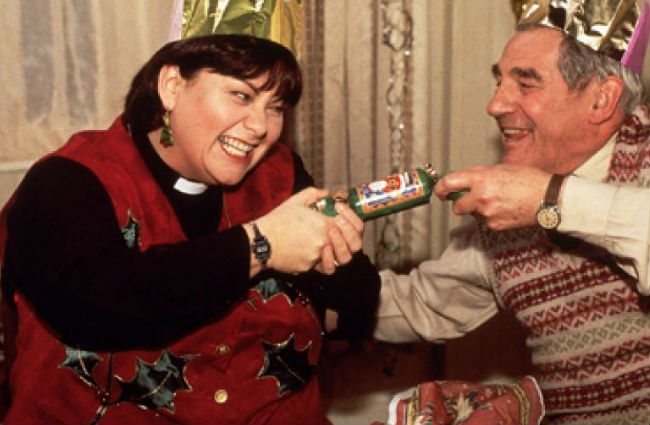 Ah bon bons! So festive and yet so hilariously violent ... Geraldine (Dawn French) and Jim Trott (Trevor Peacock) have some fun opening one at the first of the vicar's many lunches (image courtesy BBC and Tiger Aspect Productions)