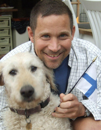 Cristof and one of his beloved Labradoodles (image courtesy Cristof Fischer)