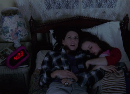 In an endearingly-quirky scene, Lorelai jumps into bed at 4.03am, the exact minute Roryw as born to recount the story of her daughter's birth, a story Rory of course knows of by heart (image courtesy Gilmore Girls wikia)