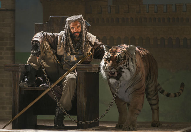 It's the zombie apocalypse so pronouncing yourself king and getting a big ass tiger to sit by your throne is totally and utterly normal okay? (image courtesy AMC)