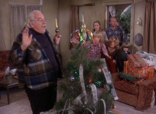 Following a sighting of the family's stolen car, everyone bursts in on Sam to retrieve their gifts and save Christmas but the thief ends up playing a key role in the family's celebration of the day (image via Christmas TV History (c) Warner Bros)